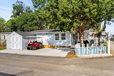 View of front of home featuring a storage unit