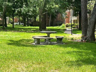 Outdoor seating overlooking serene park-like surro