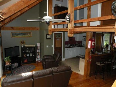 Living Room. There are exposed...