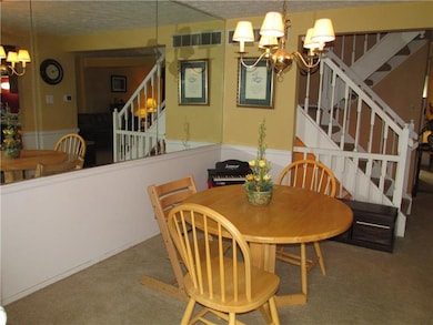The dining space is generous and carpeted wall to 