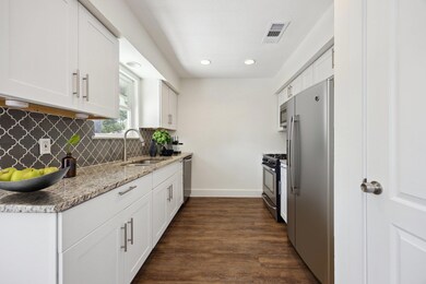 Kitchen featuring appliances with stainless steel