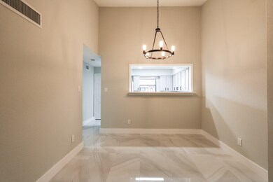 Dining area with custom chandelier.