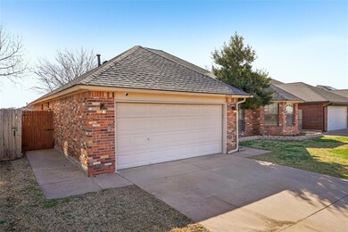 Garage with concrete driveway and fence