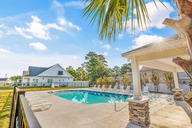 Community pool featuring a patio area
