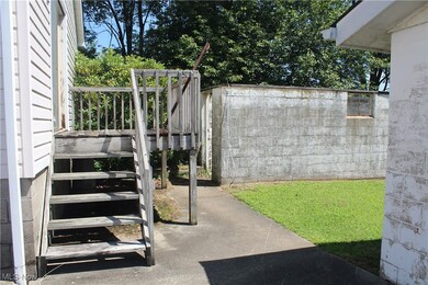 View of yard featuring stairway and a patio