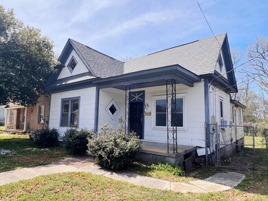 Bungalow-style house with a porch and a shingled r