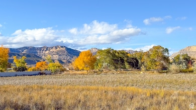 View of mountain backdrop with rural landscape