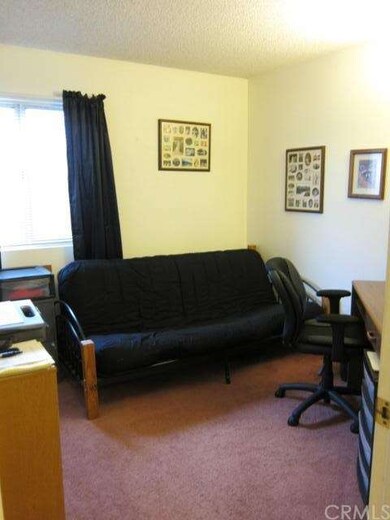 This bedroom has been turned into a office but can