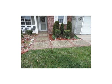 Stone sidewalk and nice landscaping.