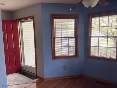 Entry foyer and kitchen bay.