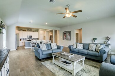 LIVING/DINING/KITCHEN    One large space includes multiple gathering areas.  The open concept floorplan enables everyone to join in the festivities.