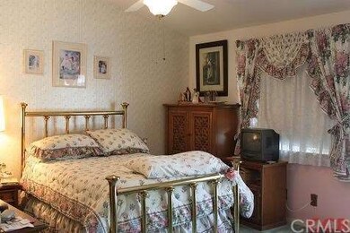 master bedroom with slider to the back yard