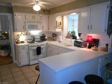 Kitchen has lots of cabinets and counter space