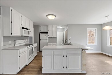 KITCHEN & MORNING ROOM VIEW.  DOOR STRAIGHT AHEAD