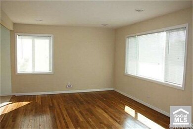 Refinished hardwood floors and new windows in the 