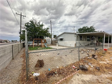 View of front of home with a fenced backyard, a playground, and a patio