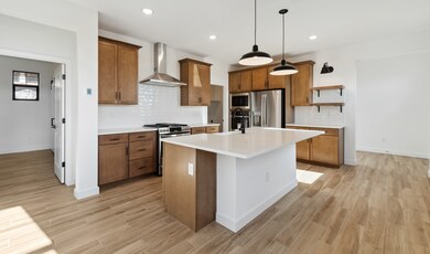 Kitchen with pendant lighting & floating shelves