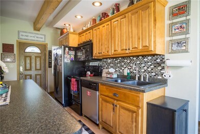 Newer backsplash.  Front door entrance in distance