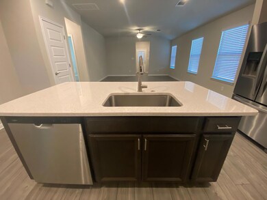 Kitchen featuring stainless steel appliances, lig