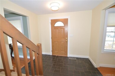 Spacious foyer with guest closet and new exterior 