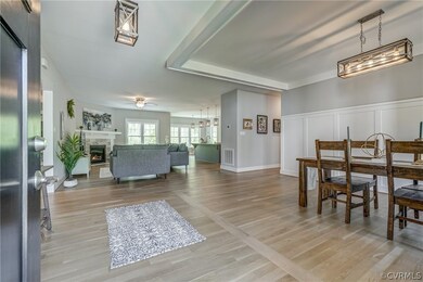 Walking in, appreciate the hardwood floors and ope