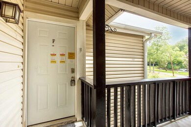 Entrance to property featuring a porch