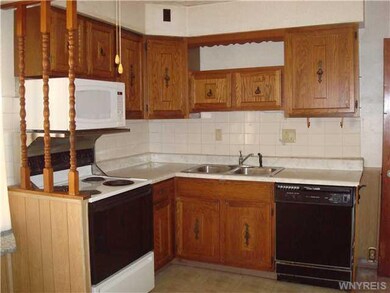 Kitchen Ceramic tile kitchen includes wood cabinet