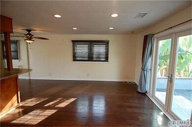 Living room with wood floors and canned lighting