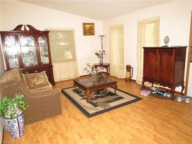 The living room is in the front of the house, wher