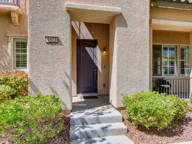 View of exterior entry with stucco siding