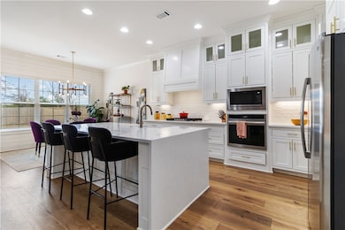 Kitchen features large island, walk-in pantry, din