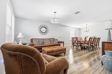 Living room with a chandelier and wood finished floors