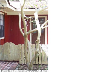 COURTYARD ENTRY ADJACENT TO SIDE ARBOR ENTRY