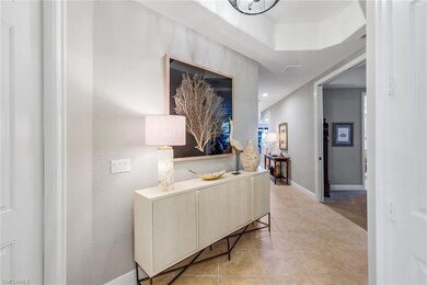 Entry Hall with baseboards and light tile patterned floors