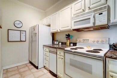 Cooking area includes a microwave, cooktop range and oven.