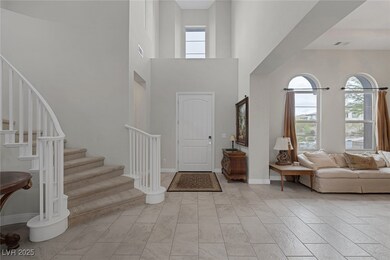 Entrance foyer with stairway, half bath, and Forma