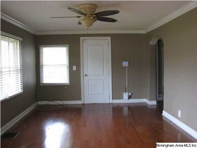 The living room has very nice laminate hardwoods.