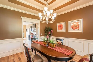 Dining Room has double trey ceiling & elegant trim.