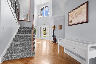 Step inside your foyer to a formal dining room on the Right and Powder Room to the Left