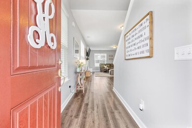 Foyer entrance with baseboards and wood finished floors