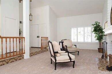 Double door entry to spacious Living Room with vau