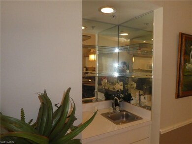 Wet bar with glass shelving