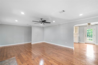 Empty room with ceiling fan, ornamental molding, 