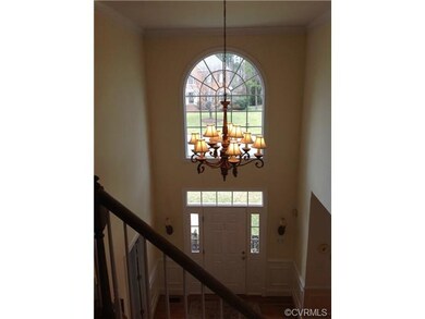 Gorgeous chandelier in this welcoming entrance!