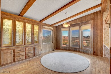 Sitting room featuring a textured ceiling, lofted