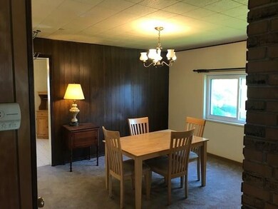 Spacious formal dining room just off the kitchen