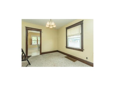Formal dining room with chandelier lighting and a 