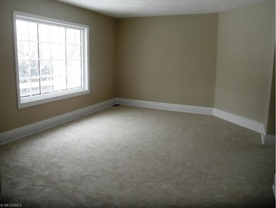 Light and bright Living Room has all fresh paint and new carpeting