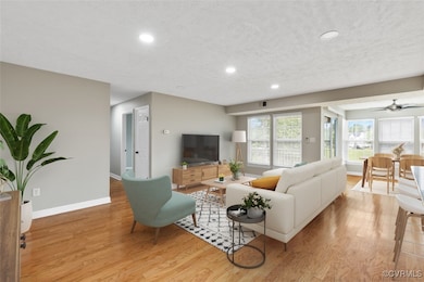 Living area featuring recessed lighting, light woo