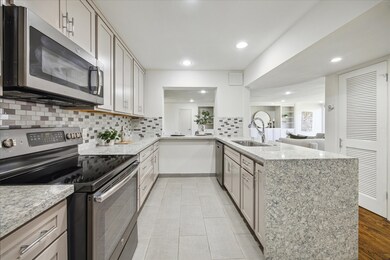 Beautiful quartz counter waterfall peninsula.